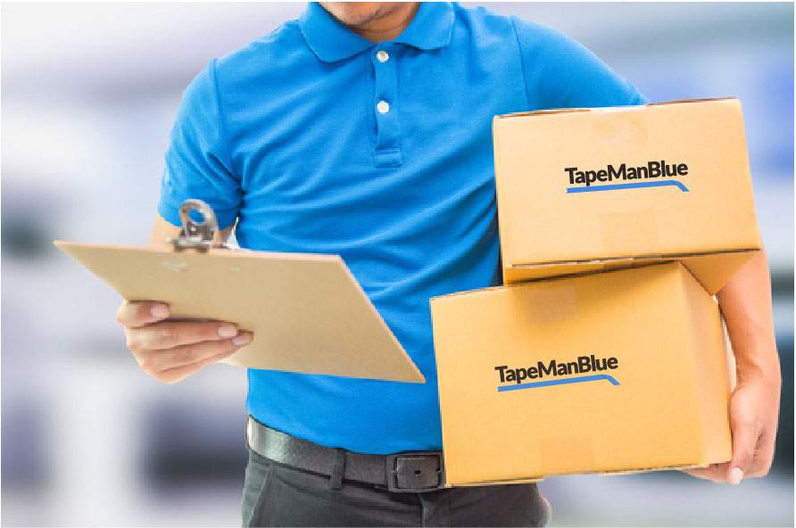 man carrying boxes of TapeManBlue tape